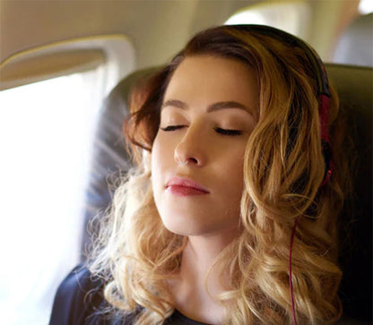 Woman on plane with nose diffuser in nose