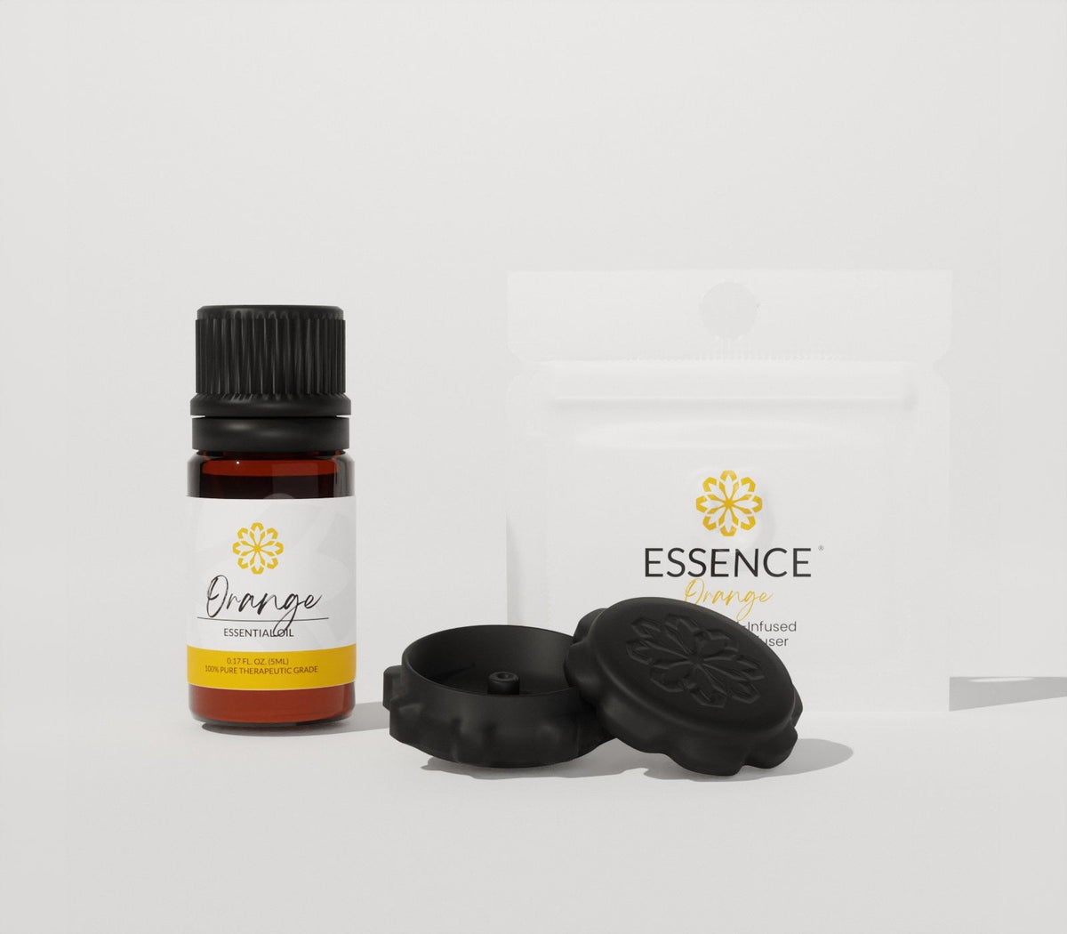 The Essence Club box contents: featured oil, scent ring 5-pack, and pearl soaking bay